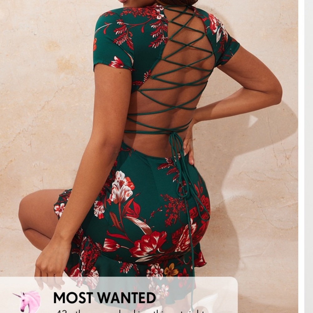 Emerald green criss cross back frill hem bodycon dress